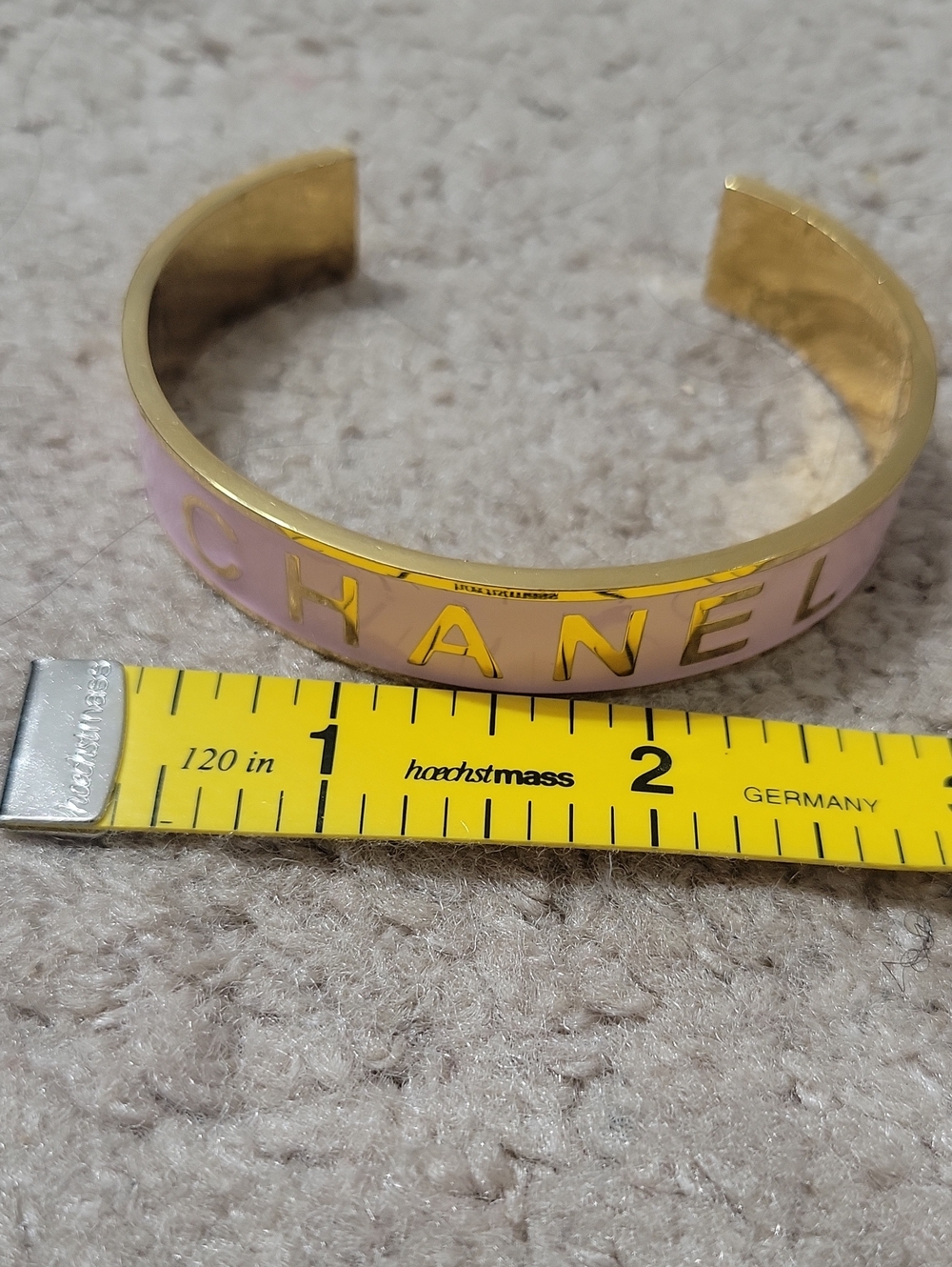 CHANEL Gold-Tone Cuff Bracelet with Light Pink Enamel Logo